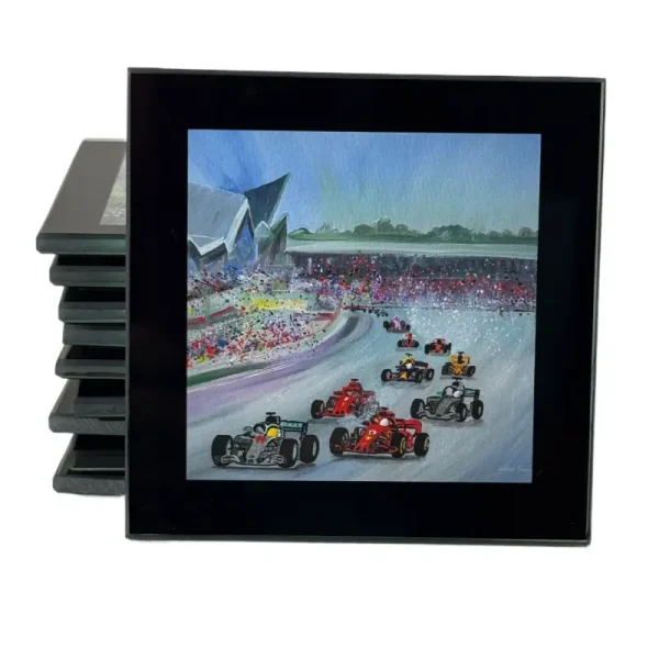 A coaster showing a painting of the British Grand Prix by Julia Tanner