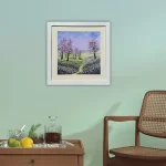 cherry blossom in a white frame shown in a room setting