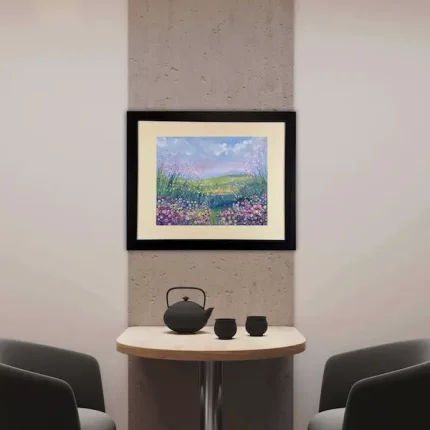 a painting by Isle of Wight artist Julia Tanner called evening stroll in a black frame in a room setting