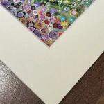 summer at the needles, the corner of a print in a mount by Isle of Wight artist Julia Tanner