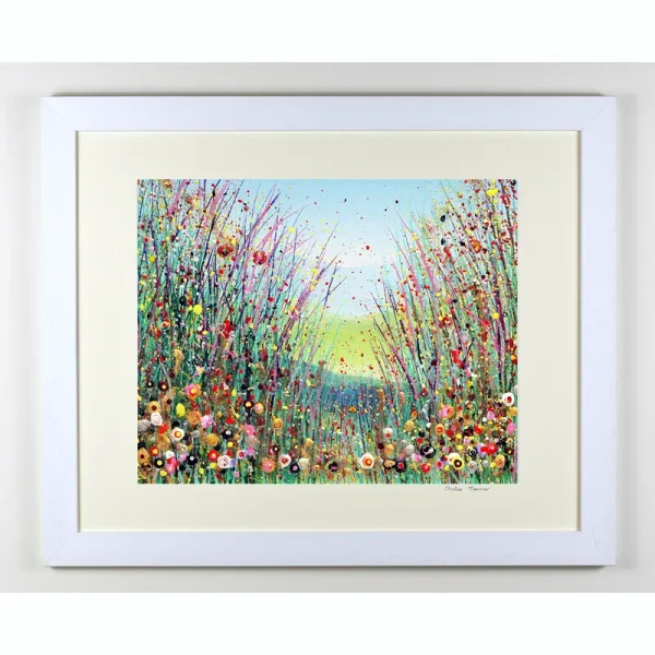 summer meadow framed hand embellished print a white framed hand embellished print of a wildflower meadow by Isle of Wight artist Julia Tanner