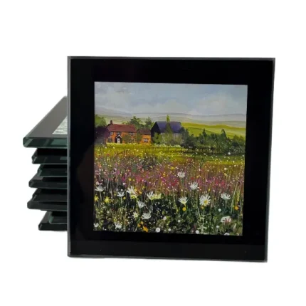 a coaster of a cottage in the country with a wildflower meadow by Julia Tanner art