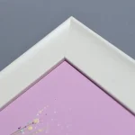 a detail of the frame of pretty in pink by Julia Tanner Art