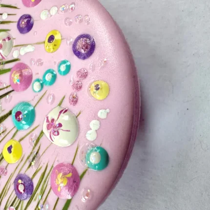 side view of pretty in pink round flower meadow brooch by Julia Tanner