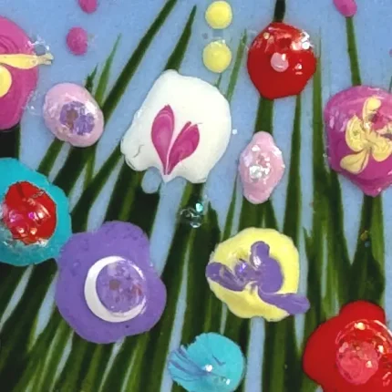 close up of the flowers on a blue brooch by Julia tanner art