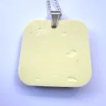 reverse side of a square lemon necklace