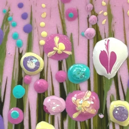 close up of the flowers on a pink flower meadow brooch by Julia tanner