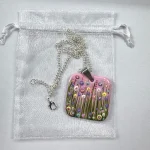 pink square flower meadow pendant with a gift bag by Julia tanner